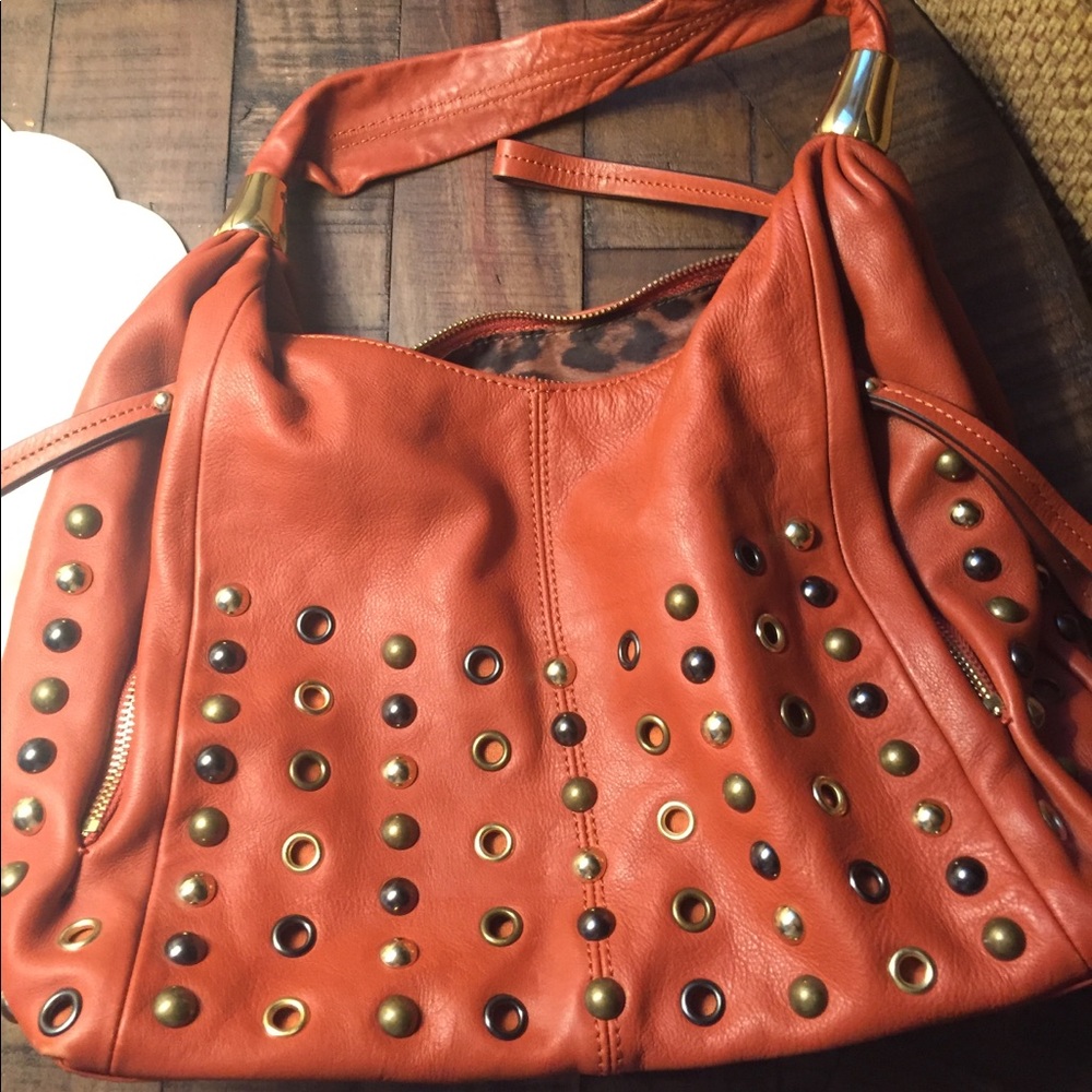 B Makowski burnt orange satchel metal grommets